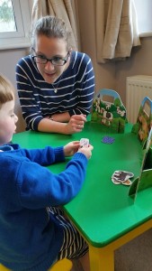 child playing with learning tools